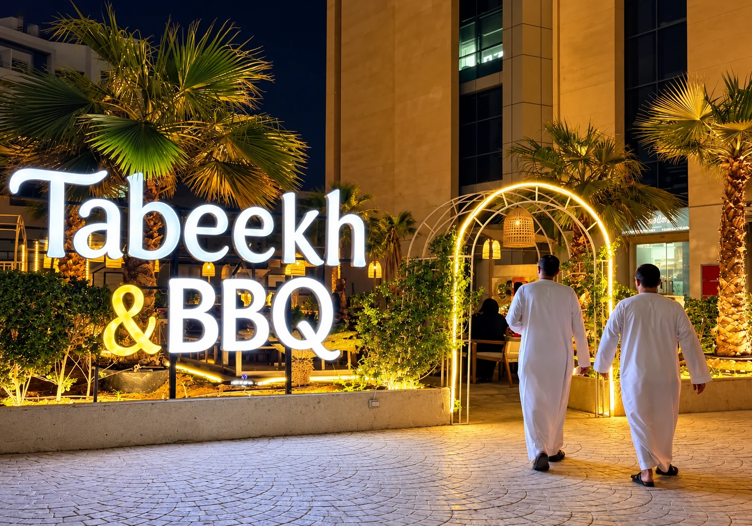 Tabeekh & BBQ illuminated entrance at night